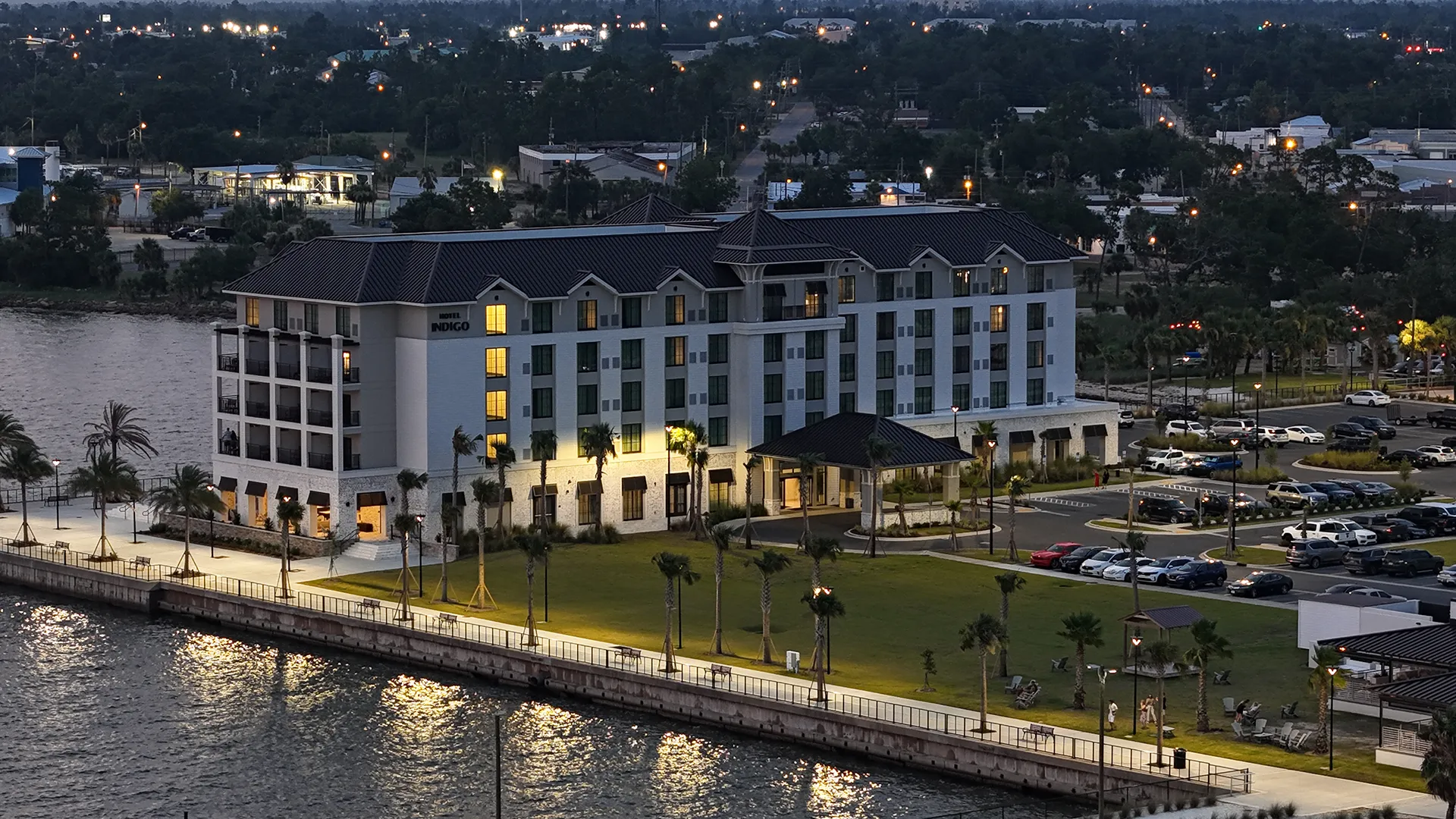 Aerial view of waterfront commercial property at dusk