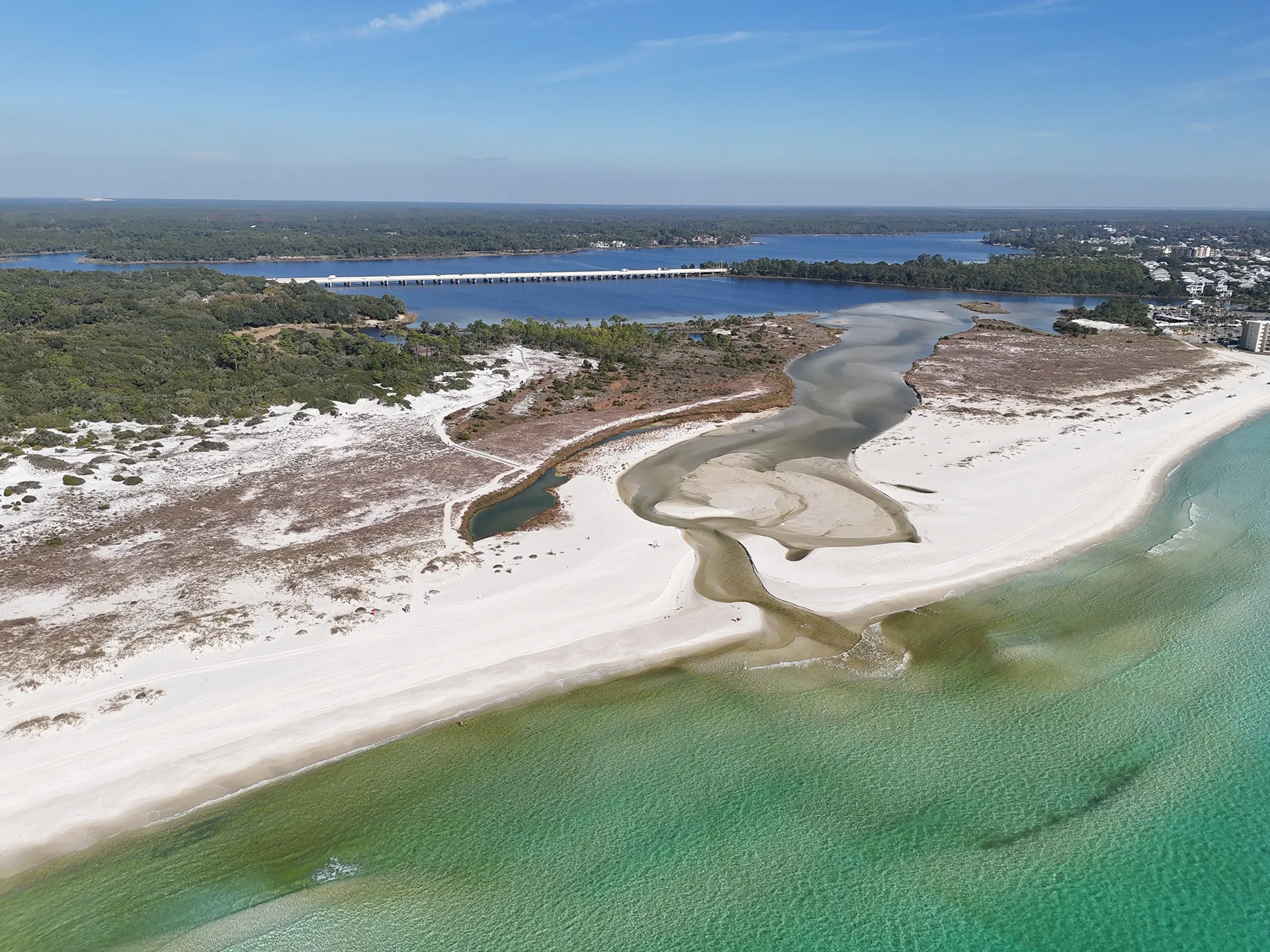 Aerial view of beach, water, and coastal shoreline